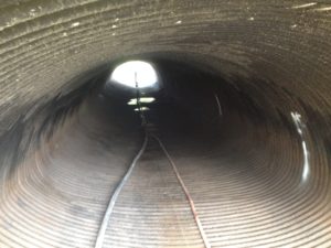 A large pipe in disrepair.